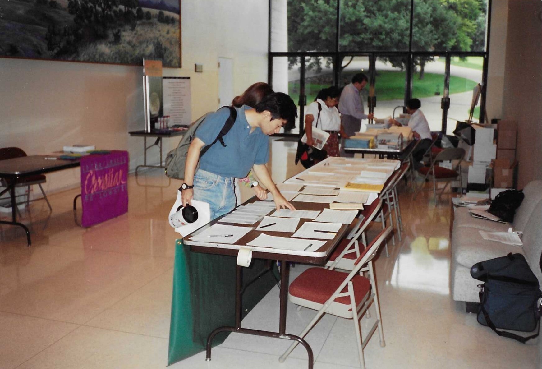 Photo - Students Perusing 1st Grad Resources Table at Orientation- Austin